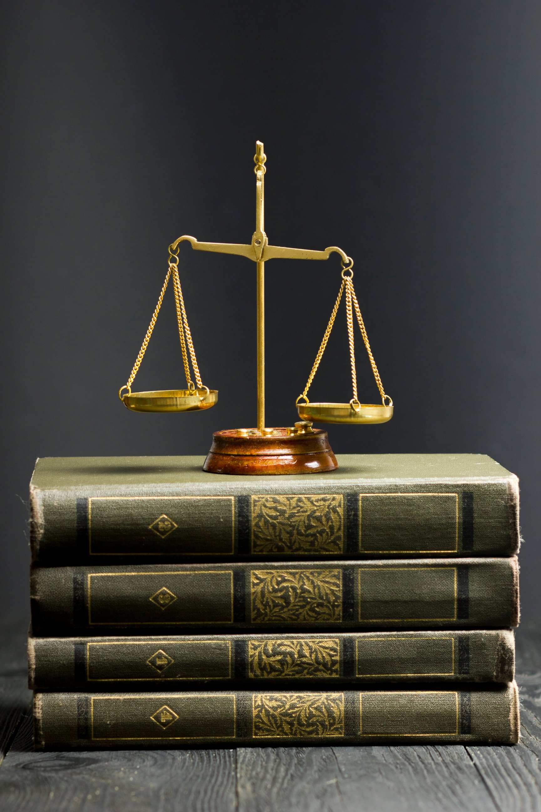 Legal Law concept - Open law book with a wooden judges gavel on table in a courtroom or law enforcement office. Copy space for text